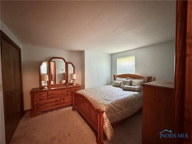 410 E Bartlow St, Deshler, OH 43516 - bedroom with light colored carpet and a textured ceiling