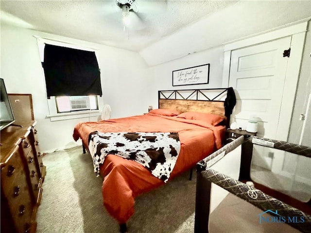 620 Division St, Defiance, OH 43512 - carpeted bedroom featuring cooling unit, lofted ceiling, a textured ceiling, and a ceiling fan