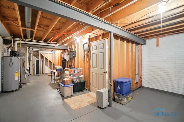 41 Shenandoah Cir, Sylvania, OH 43560 - unfinished basement with water heater, brick wall, and heating unit