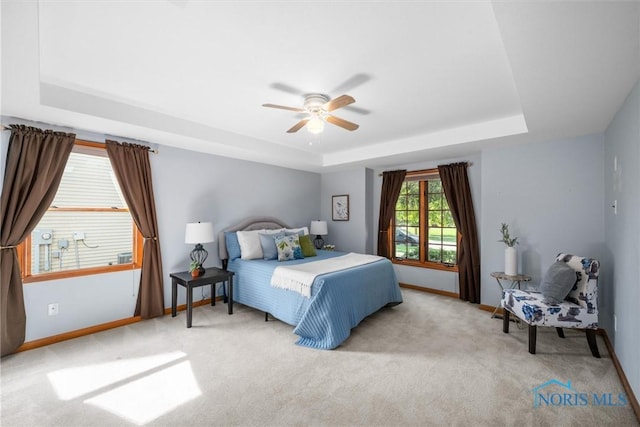 14691 Ramblehurst Dr, Perrysburg, OH 43551 - bedroom with a tray ceiling, carpet, and ceiling fan