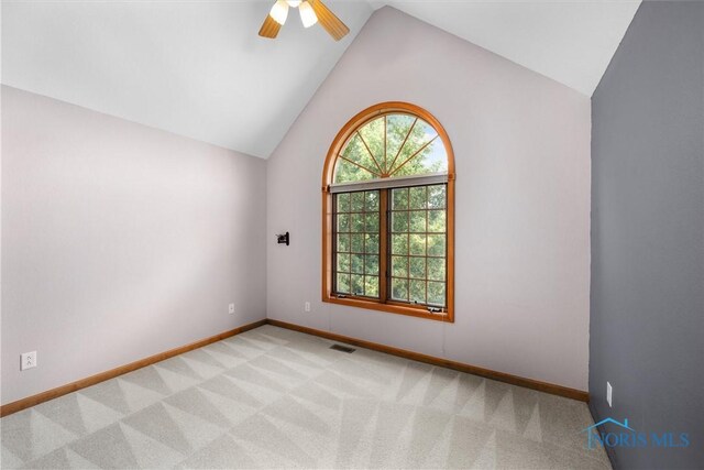 14691 Ramblehurst Dr, Perrysburg, OH 43551 - empty room with plenty of natural light, vaulted ceiling, light colored carpet, and ceiling fan