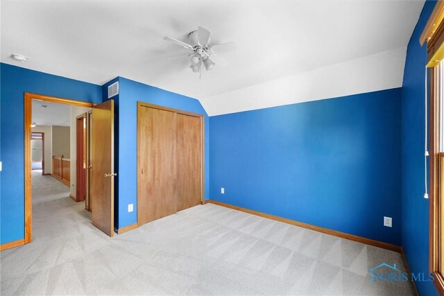 14691 Ramblehurst Dr, Perrysburg, OH 43551 - unfurnished bedroom featuring carpet, a closet, vaulted ceiling, and a ceiling fan