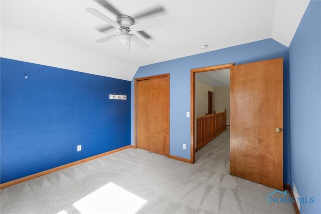 14691 Ramblehurst Dr, Perrysburg, OH 43551 - unfurnished bedroom featuring vaulted ceiling, light carpet, a closet, and ceiling fan