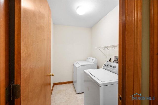 14691 Ramblehurst Dr, Perrysburg, OH 43551 - laundry area with independent washer and dryer and light tile patterned floors
