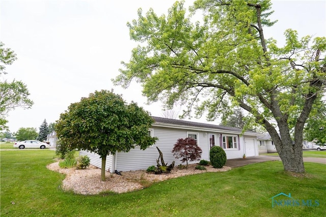 317 E Rosewood Ave, Defiance, OH 43512 - view of front of house with a front lawn, an attached garage, and concrete driveway