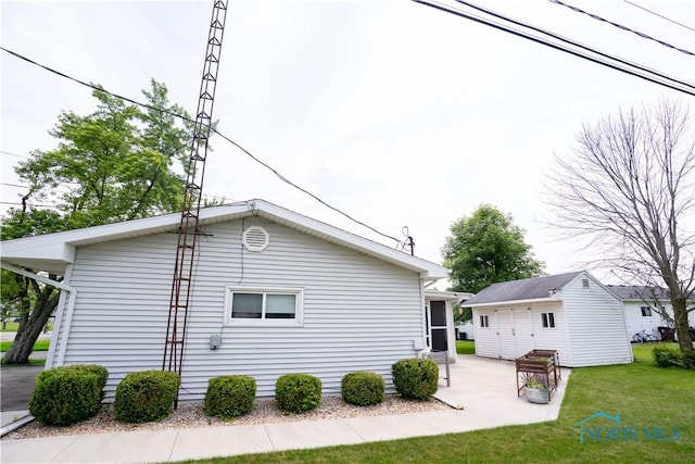 317 E Rosewood Ave, Defiance, OH 43512 - view of home's exterior with a yard and a patio