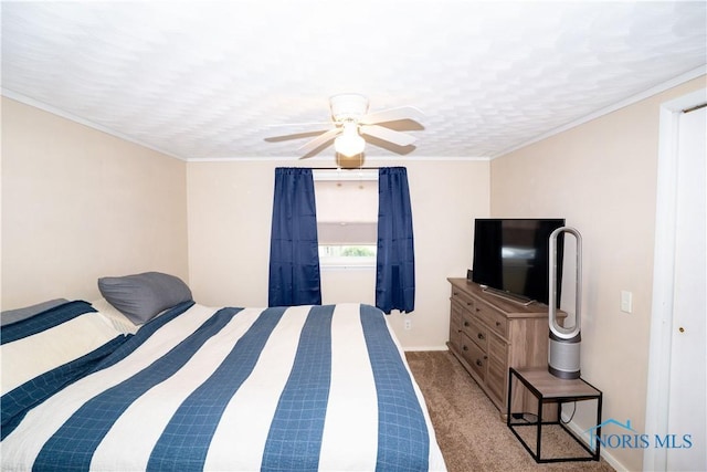 317 E Rosewood Ave, Defiance, OH 43512 - carpeted bedroom with ceiling fan and ornamental molding