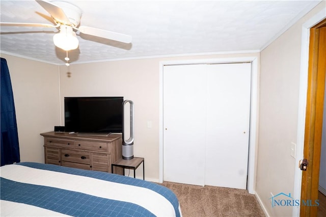 317 E Rosewood Ave, Defiance, OH 43512 - bedroom with carpet, a closet, ceiling fan, and crown molding