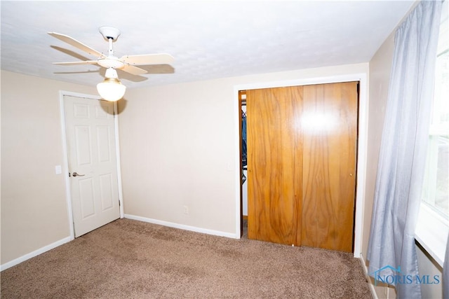 317 E Rosewood Ave, Defiance, OH 43512 - unfurnished bedroom with carpet, a closet, and ceiling fan