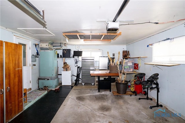317 E Rosewood Ave, Defiance, OH 43512 - garage with a garage door opener and freestanding refrigerator
