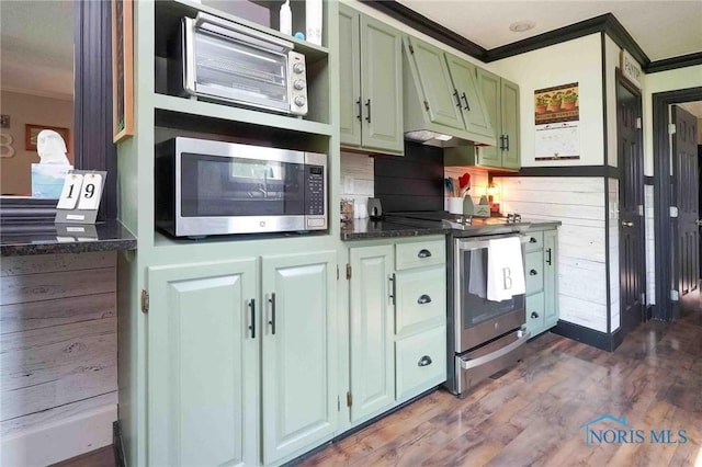 10549 Cygnet Rd, Cygnet, OH 43413 - kitchen featuring appliances with stainless steel finishes, crown molding, green cabinetry, dark countertops, and dark wood-style floors