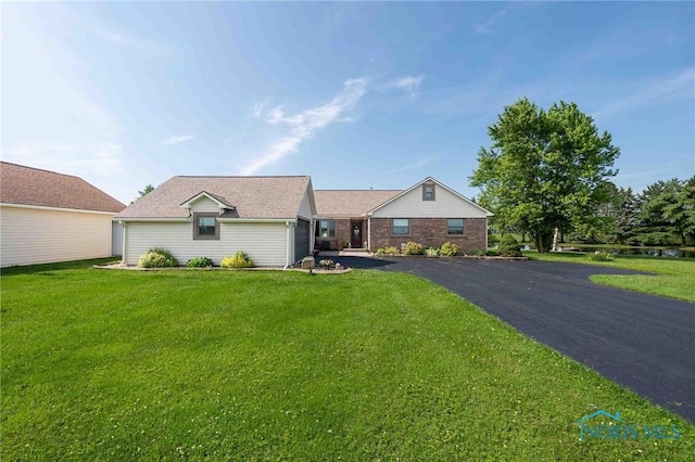 10549 Cygnet Rd, Cygnet, OH 43413 - single story home with a front yard and asphalt driveway