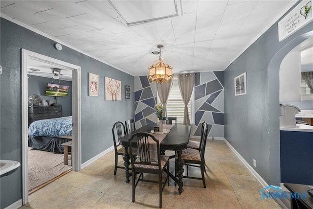 411 Seneca St, Defiance, OH 43512 - dining room with ornamental molding, arched walkways, and a chandelier