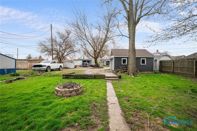 411 Seneca St, Defiance, OH 43512 - view of yard with a fire pit and an outbuilding