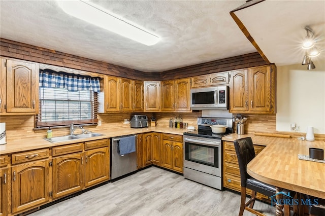 807 S Jefferson St, Pandora, OH 45877 - kitchen featuring appliances with stainless steel finishes, light countertops, and backsplash