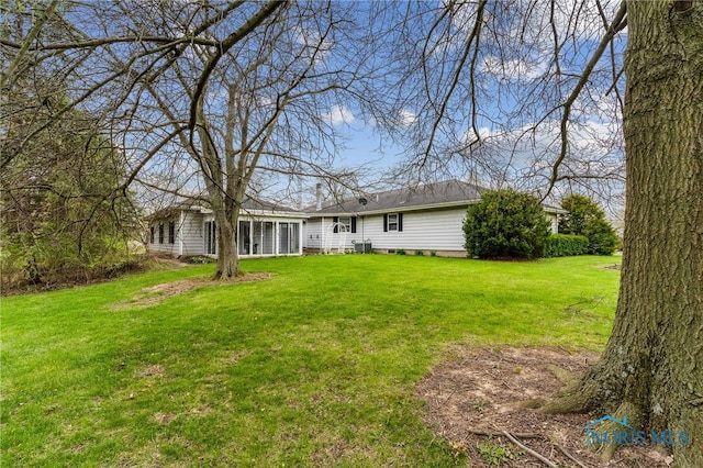 807 S Jefferson St, Pandora, OH 45877 - back of house with a lawn