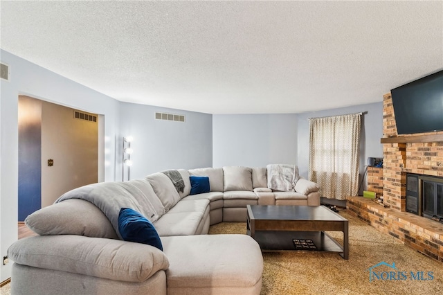 807 S Jefferson St, Pandora, OH 45877 - carpeted living area with a fireplace and a textured ceiling