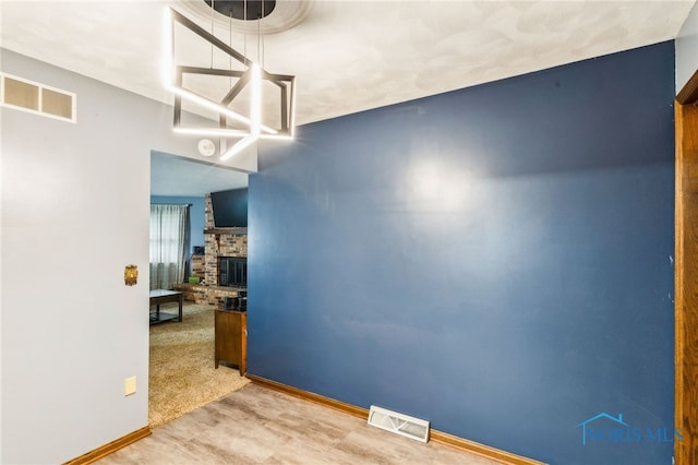 807 S Jefferson St, Pandora, OH 45877 - unfurnished room with baseboards and a fireplace