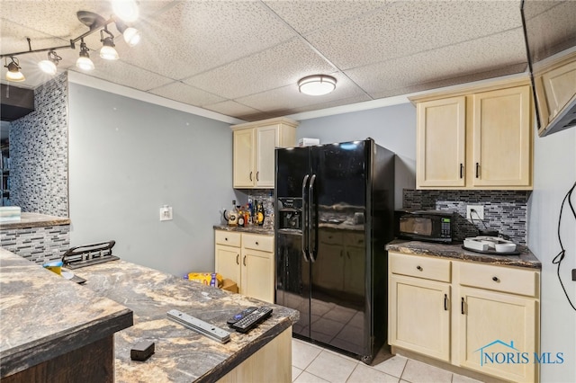 807 S Jefferson St, Pandora, OH 45877 - kitchen featuring black appliances, tasteful backsplash, cream cabinets, light tile patterned floors, and a drop ceiling