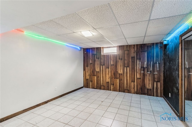 807 S Jefferson St, Pandora, OH 45877 - below grade area featuring wood walls and a paneled ceiling