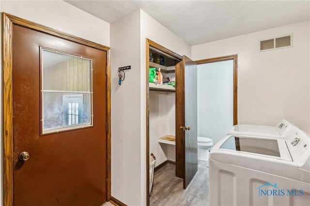 807 S Jefferson St, Pandora, OH 45877 - laundry area featuring separate washer and dryer and light wood-type flooring