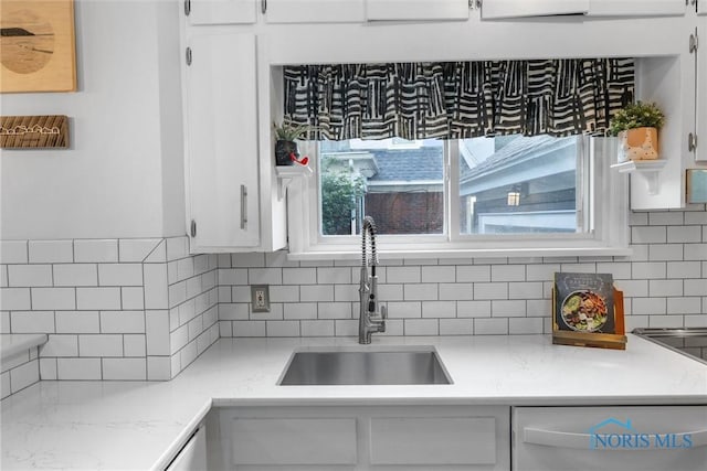 3418 Kirkwall Rd, Toledo, OH 43606 - kitchen with dishwasher, tasteful backsplash, and white cabinets
