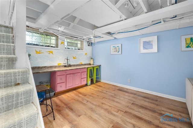 3418 Kirkwall Rd, Toledo, OH 43606 - bar with light wood-type flooring and decorative backsplash