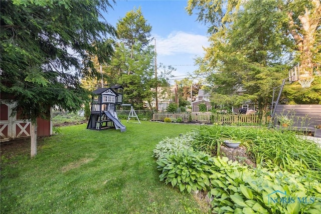 3418 Kirkwall Rd, Toledo, OH 43606 - view of yard with a playground and a storage shed