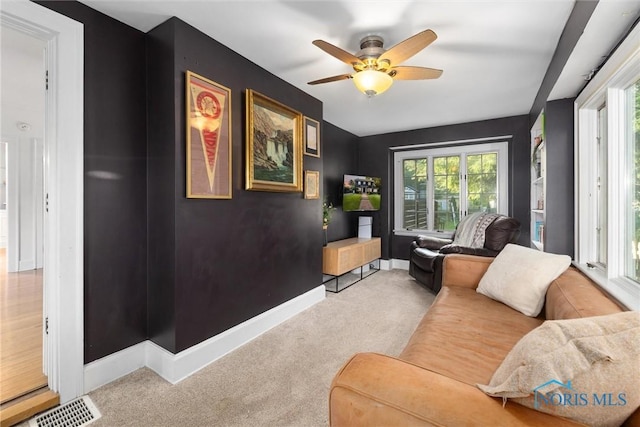 3418 Kirkwall Rd, Toledo, OH 43606 - carpeted living area with a ceiling fan and baseboards