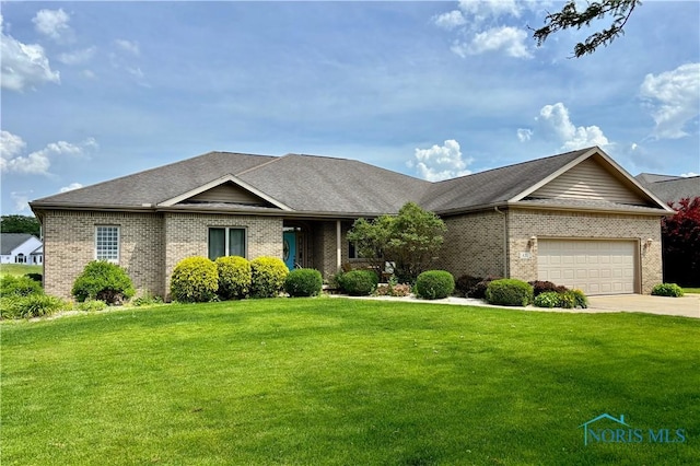 421 Pine Valley Dr, Bowling Green, OH 43402 - view of front of house with brick siding, a front yard, an attached garage, driveway, and a shingled roof