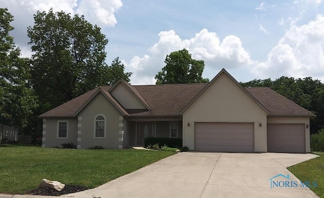 1623 Evan Dr, Defiance, OH 43512 - ranch-style house featuring an attached garage, driveway, a front yard, and roof with shingles