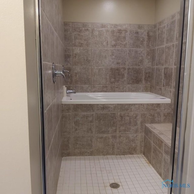 1623 Evan Dr, Defiance, OH 43512 - full bath with a shower stall, tiled tub, and tile patterned floors