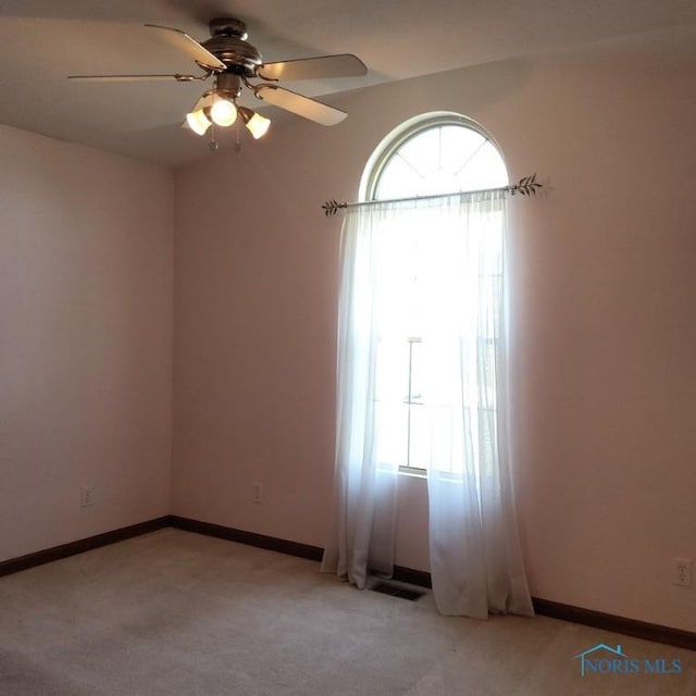 1623 Evan Dr, Defiance, OH 43512 - spare room featuring a ceiling fan and light carpet