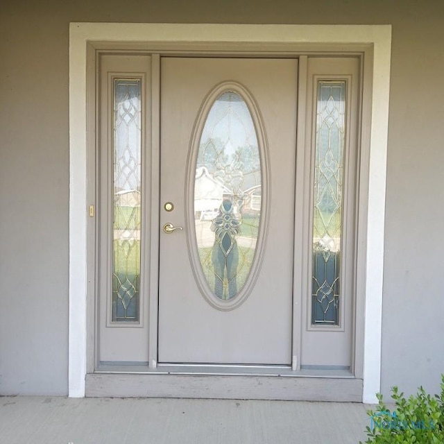 1623 Evan Dr, Defiance, OH 43512 - view of exterior entry featuring stucco siding