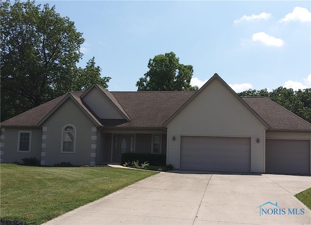 1623 Evan Dr, Defiance, OH 43512 - ranch-style house featuring a garage, concrete driveway, a front yard, and a shingled roof