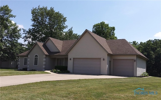1623 Evan Dr, Defiance, OH 43512 - view of front facade with a garage, concrete driveway, a front yard, and a shingled roof