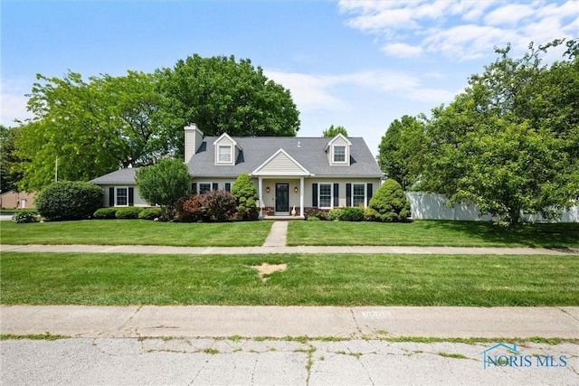 3005 Springwood St, Oregon, OH 43616 - cape cod home featuring a chimney
