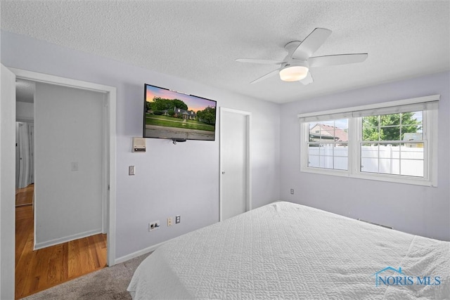 3005 Springwood St, Oregon, OH 43616 - bedroom featuring a textured ceiling and a ceiling fan