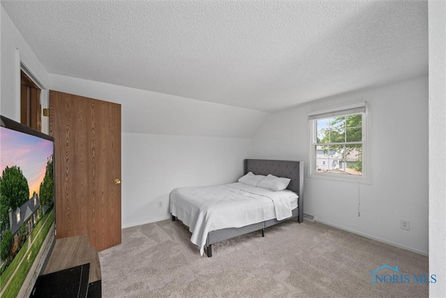3005 Springwood St, Oregon, OH 43616 - carpeted bedroom with a textured ceiling and vaulted ceiling