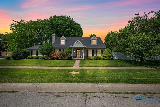 3005 Springwood St, Oregon, OH 43616 - cape cod-style house with a chimney