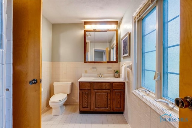 4146 Northmoor Rd, Ottawa Hills, OH 43606 - bathroom featuring tile walls, vanity, tile patterned flooring, and wainscoting