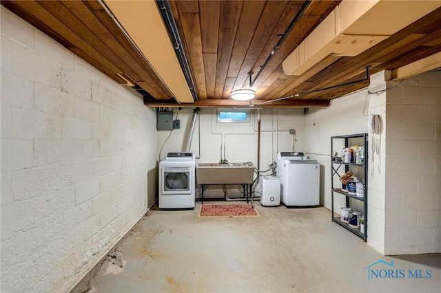 4146 Northmoor Rd, Ottawa Hills, OH 43606 - basement featuring washing machine and clothes dryer, electric panel, and concrete block wall