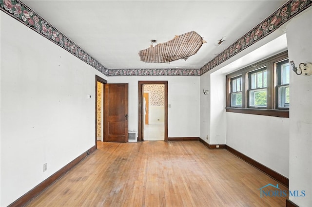 1452 Rollins Rd, Toledo, OH 43612 - spare room featuring hardwood / wood-style floors