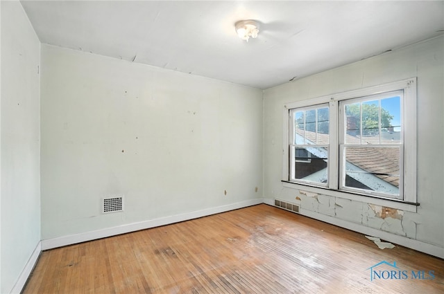 1452 Rollins Rd, Toledo, OH 43612 - spare room featuring hardwood / wood-style flooring and baseboards