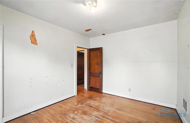 1452 Rollins Rd, Toledo, OH 43612 - spare room featuring wood finished floors and baseboards