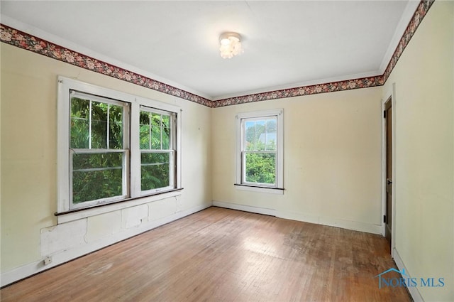1452 Rollins Rd, Toledo, OH 43612 - empty room featuring wood finished floors and baseboards