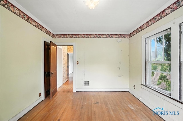 1452 Rollins Rd, Toledo, OH 43612 - empty room featuring wood finished floors and crown molding
