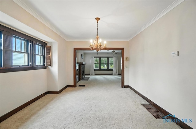 1452 Rollins Rd, Toledo, OH 43612 - corridor with light carpet, crown molding, and a chandelier