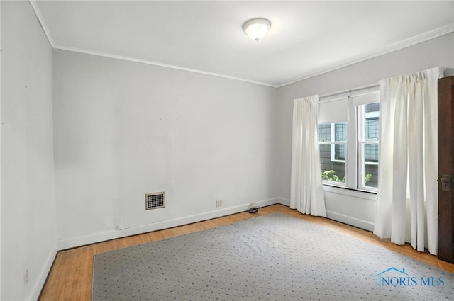 1452 Rollins Rd, Toledo, OH 43612 - unfurnished room with ornamental molding and wood finished floors