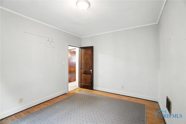 1452 Rollins Rd, Toledo, OH 43612 - unfurnished room featuring ornamental molding and wood finished floors